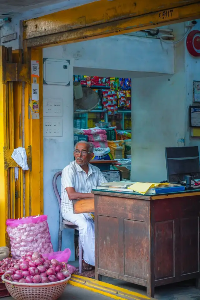 A shopkeeper at a shop counter